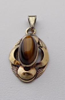 Silver and gilded pendant with a tiger’s eye
