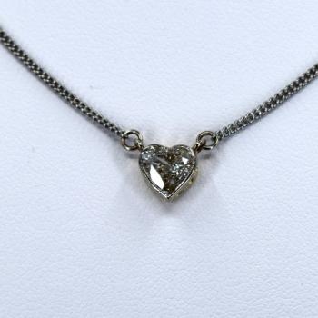 Gold necklace with a heart-shaped diamond